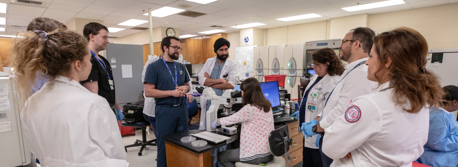 ID and Pathology attendings hold plate rounds